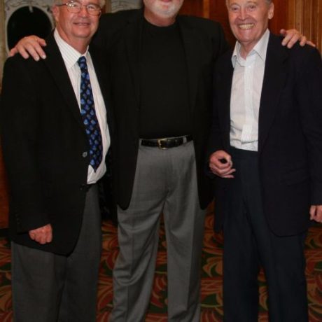 men smiling standing together for photo