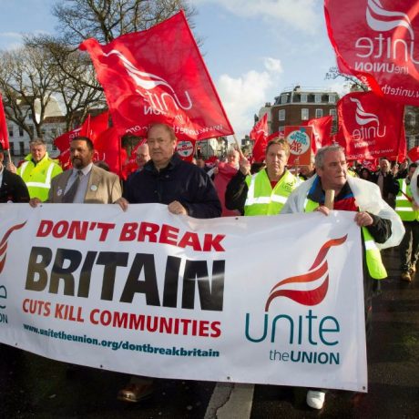 people marching with signs and flags