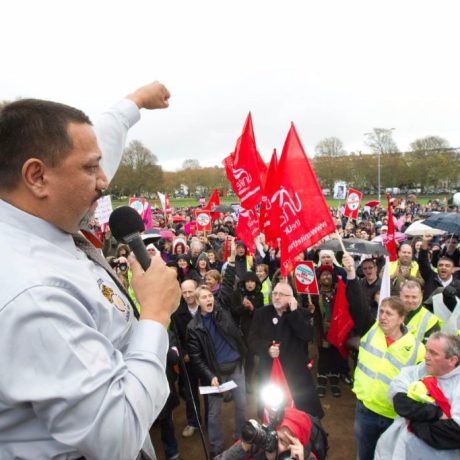 man giving speech at rally