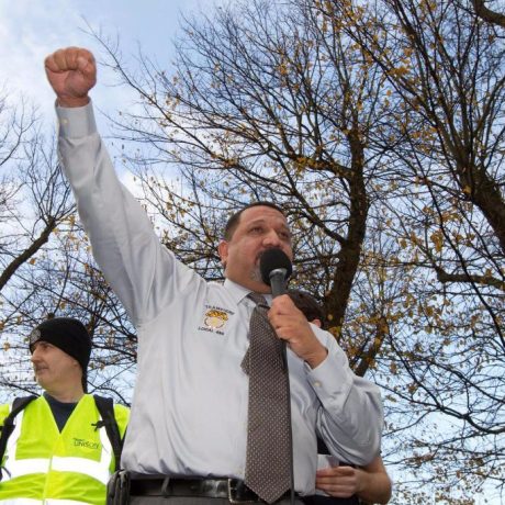 man speaking using microphone