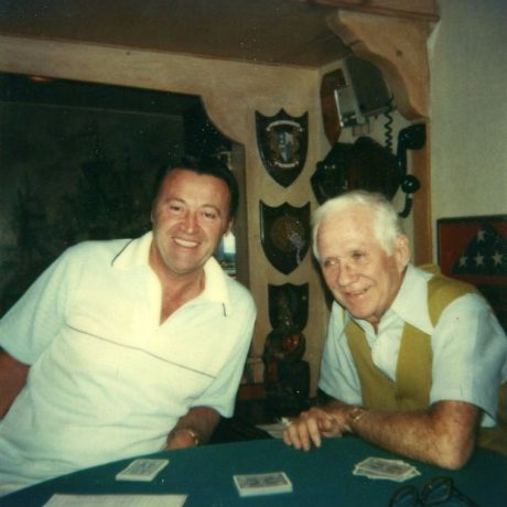 karl ullman playing cards with another man