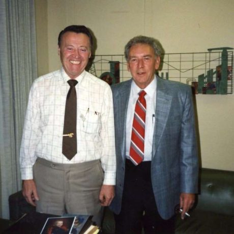 karl ullman smiling with man in a suit