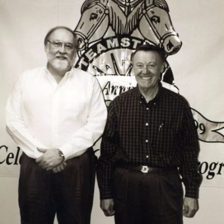 karl ullman smiling in front of teamsters local 495 poster