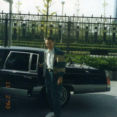 karl ullman standing in front of car