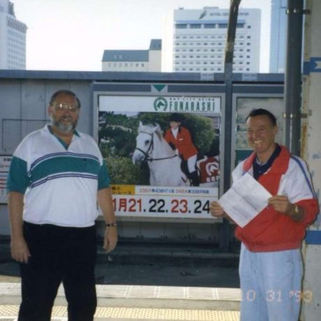 men smiling together in city