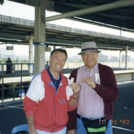 men smiling together posing