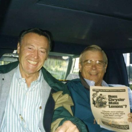 men laughing together in car