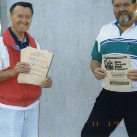 men smiling standing together