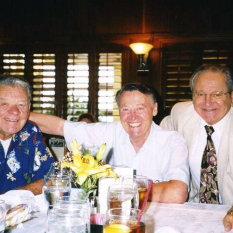 men smiling together for photo