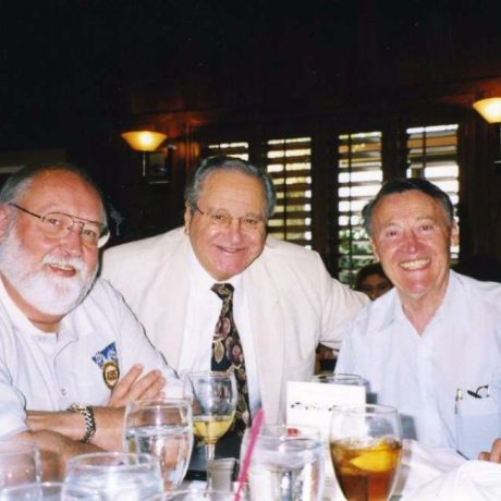 men smiling together for photo