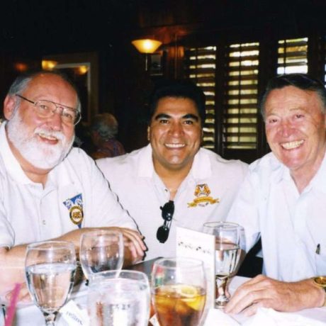 three men smiling together