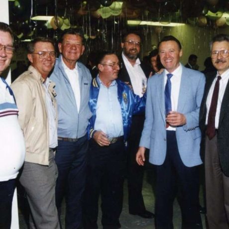 photo of men smiling together at party